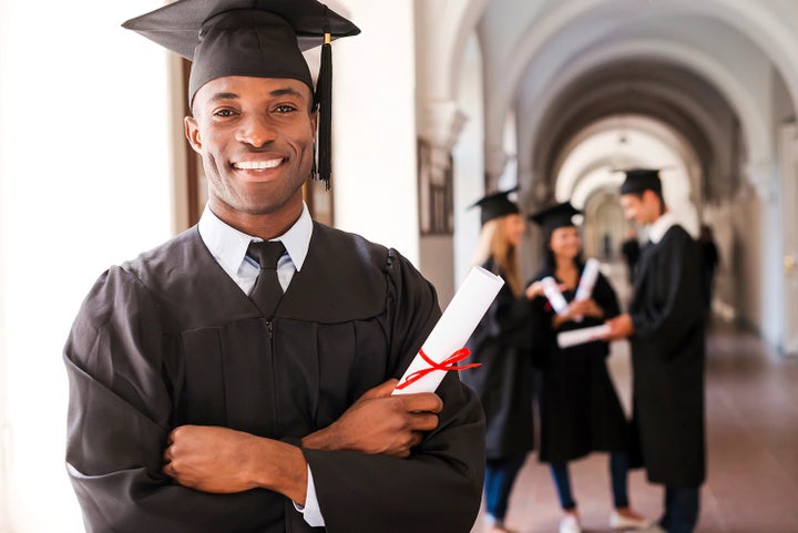 college graduate holding his diploma | Bergstrom Subaru Green Bay in Green Bay WI