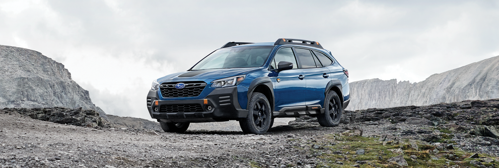 A 2023 Outback Wilderness parked in the mountains. | Bergstrom Subaru Green Bay in Green Bay WI